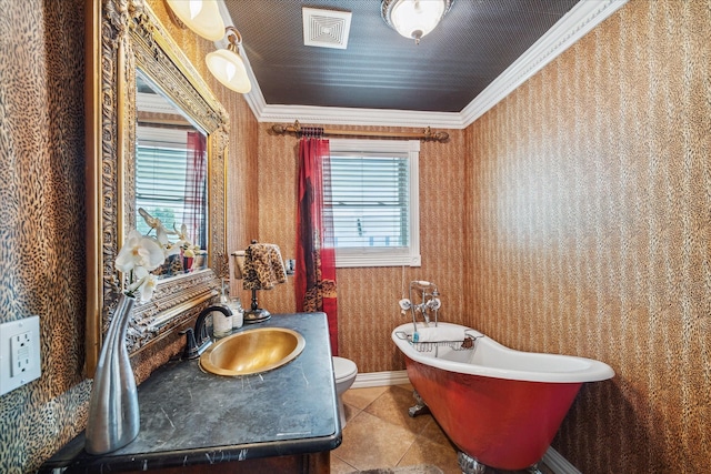 1502 Stuart St, Houston, TX 77004 - full bathroom with ornamental molding, a freestanding tub, wallpapered walls, toilet, and tile patterned floors