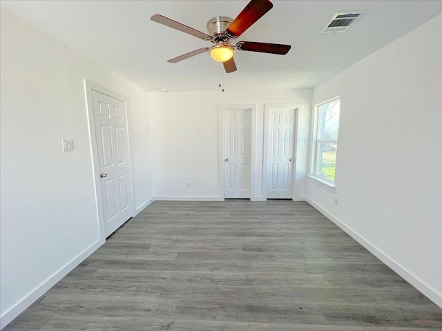 6309 Sandra St, Houston, TX 77028 - unfurnished bedroom with baseboards, wood finished floors, and ceiling fan