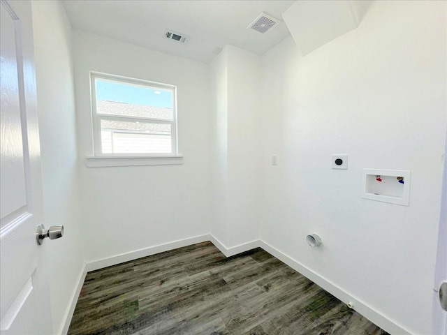 6309 Sandra St, Houston, TX 77028 - laundry area featuring dark wood-style flooring, electric dryer hookup, washer hookup, and baseboards