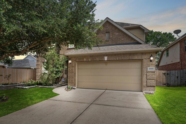 4307 Countrypines Dr, Spring, TX 77388 - view of front facade with brick siding, concrete driveway, a shingled roof, and an attached garage