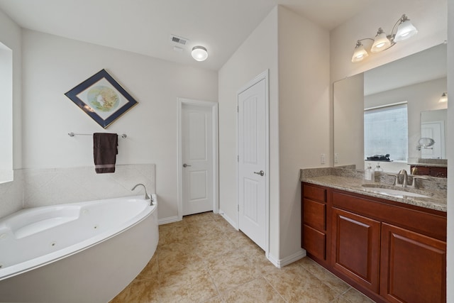 4307 Countrypines Dr, Spring, TX 77388 - bathroom featuring vanity, a whirlpool tub, and baseboards