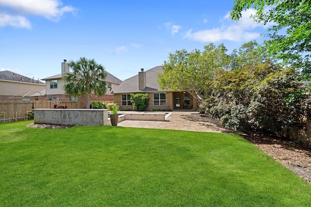 4307 Countrypines Dr, Spring, TX 77388 - rear view of property with brick siding, a patio, and a chimney