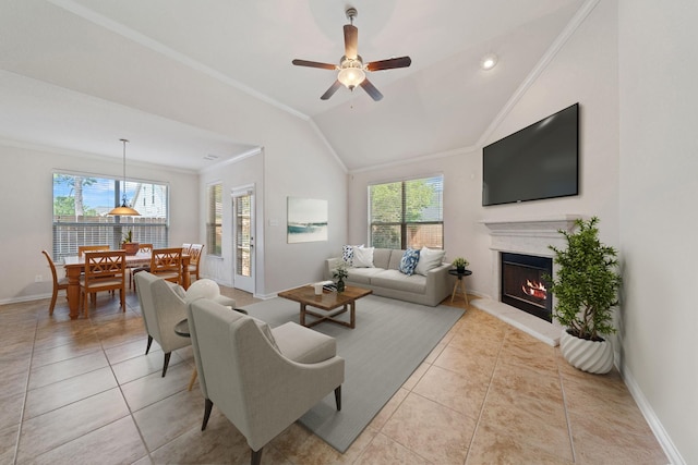 4307 Countrypines Dr, Spring, TX 77388 - living area featuring ornamental molding, a lit fireplace, baseboards, light tile patterned flooring, and lofted ceiling