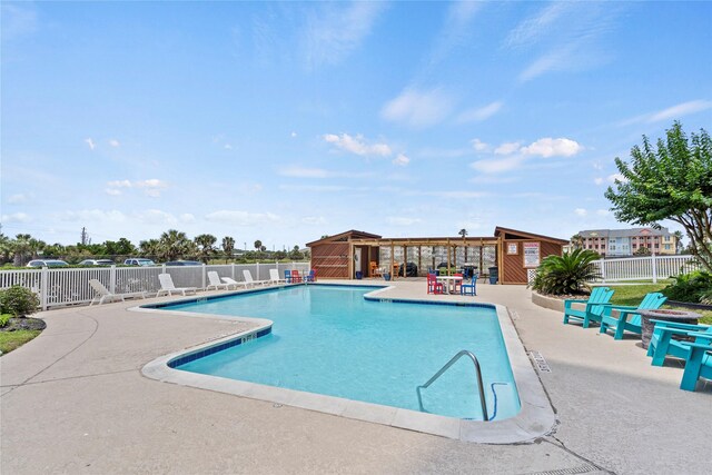 7310 Seawall Blvd Unit 707, Galveston, TX 77551 - community pool featuring fence and a patio