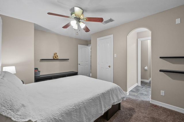 19634 Stone Lake Dr, Tomball, TX 77377 - carpeted bedroom featuring baseboards, ceiling fan, and arched walkways