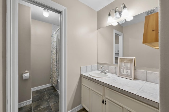 19634 Stone Lake Dr, Tomball, TX 77377 - bathroom featuring baseboards, vanity, and shower / bath combination with curtain