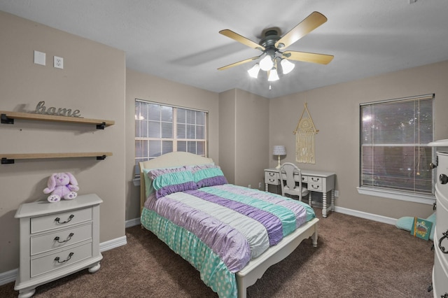 19634 Stone Lake Dr, Tomball, TX 77377 - bedroom featuring dark carpet, baseboards, and ceiling fan