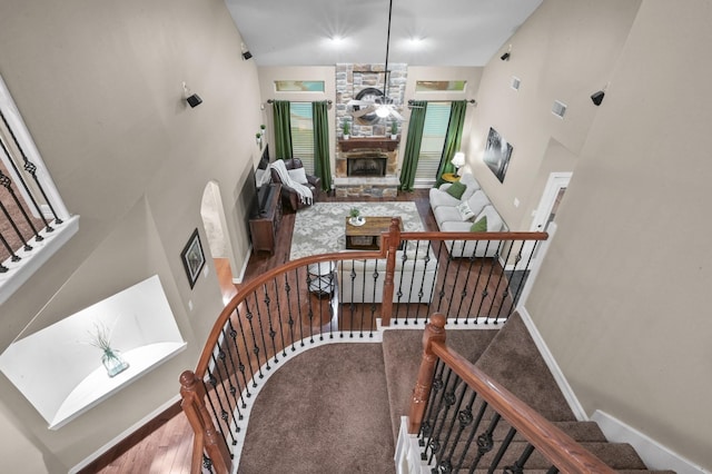 19634 Stone Lake Dr, Tomball, TX 77377 - stairway with a towering ceiling, a fireplace, and baseboards