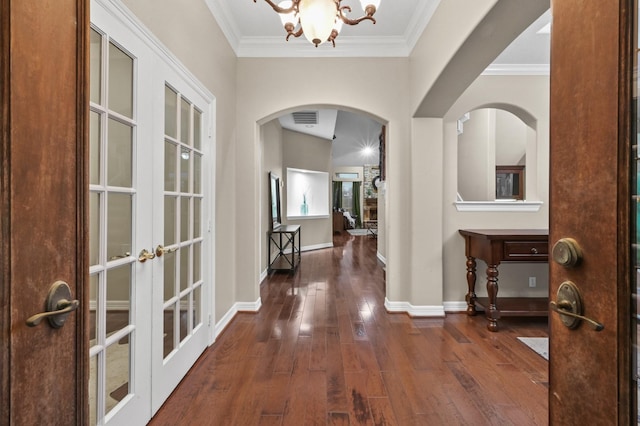 19634 Stone Lake Dr, Tomball, TX 77377 - entryway with arched walkways, hardwood / wood-style flooring, french doors, a chandelier, and baseboards
