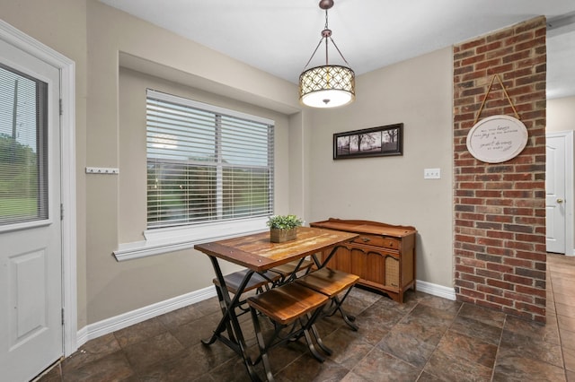 19634 Stone Lake Dr, Tomball, TX 77377 - dining room with baseboards and dark stone finish flooring