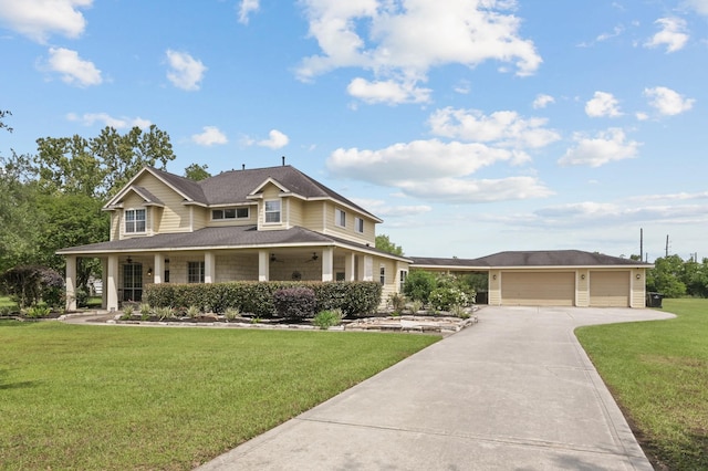 19634 Stone Lake Dr, Tomball, TX 77377 - country-style home featuring concrete driveway, a front lawn, a garage, and covered porch