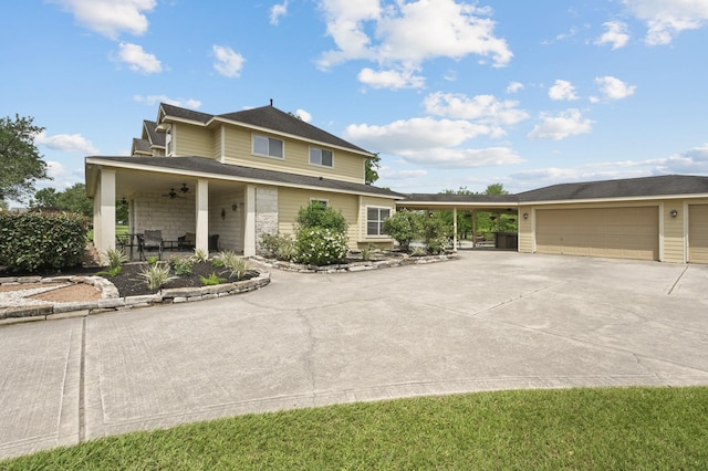 19634 Stone Lake Dr, Tomball, TX 77377 - view of front of house with concrete driveway and a ceiling fan