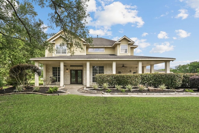 19634 Stone Lake Dr, Tomball, TX 77377 - view of front facade featuring a front lawn, french doors, ceiling fan, roof with shingles, and covered porch