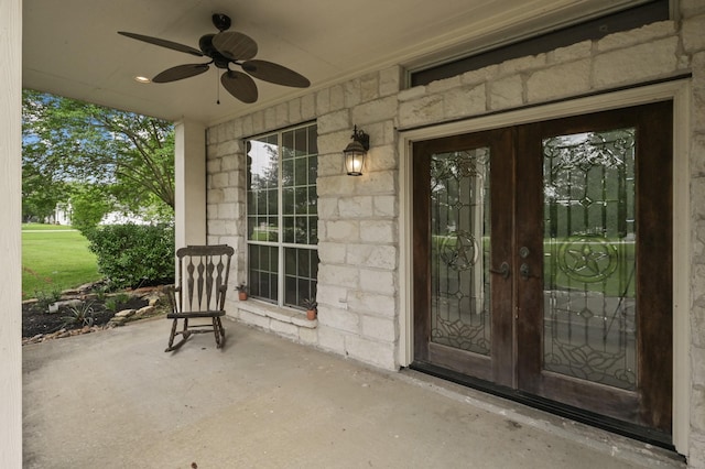 19634 Stone Lake Dr, Tomball, TX 77377 - doorway to property with stone siding, ceiling fan, and a patio