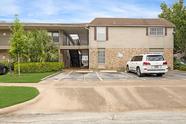606 Marshall St Unit C2, Houston, TX 77006 - view of building exterior featuring uncovered parking