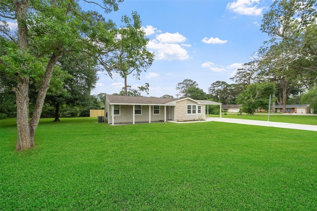 5117 Winding Way, Dickinson, TX 77539 - ranch-style house with a carport, a front yard, and driveway