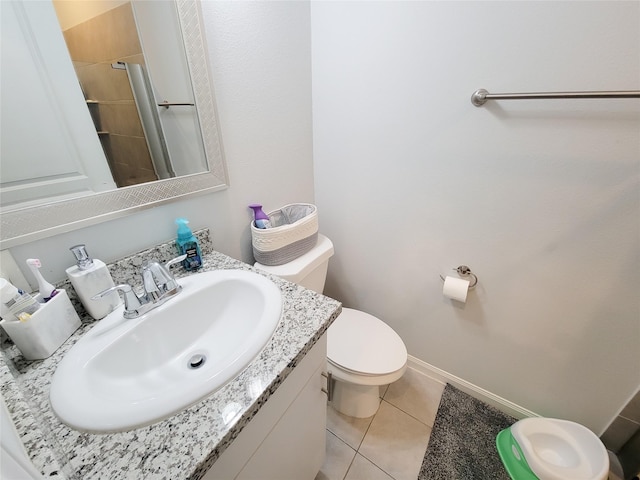 18841 Elegance Ave, Spring, TX 77379 - bathroom featuring tile patterned floors, toilet, vanity, and baseboards