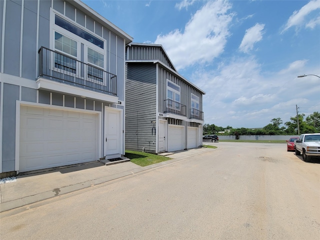 18841 Elegance Ave, Spring, TX 77379 - view of front of home with a water view and board and batten siding