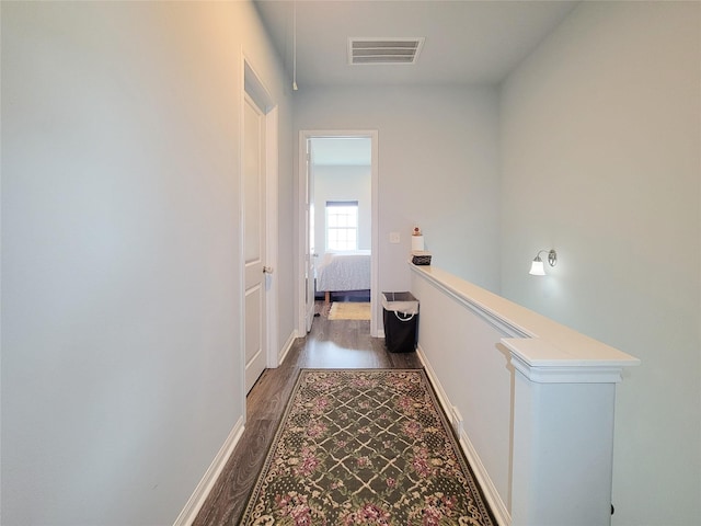 18841 Elegance Ave, Spring, TX 77379 - hallway featuring an upstairs landing, wood finished floors, and baseboards