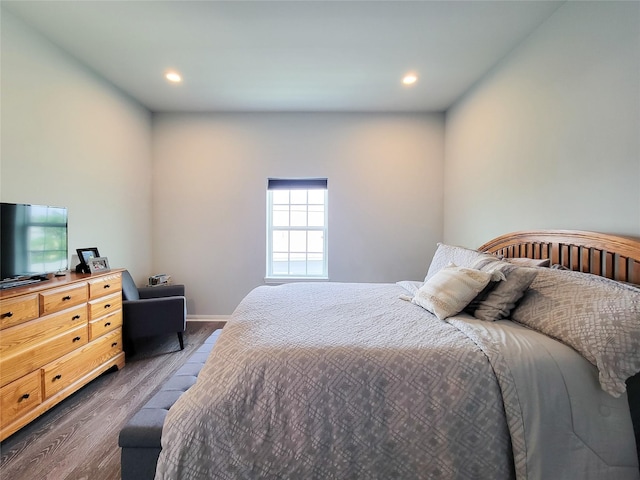 18841 Elegance Ave, Spring, TX 77379 - bedroom with dark wood-style floors and recessed lighting