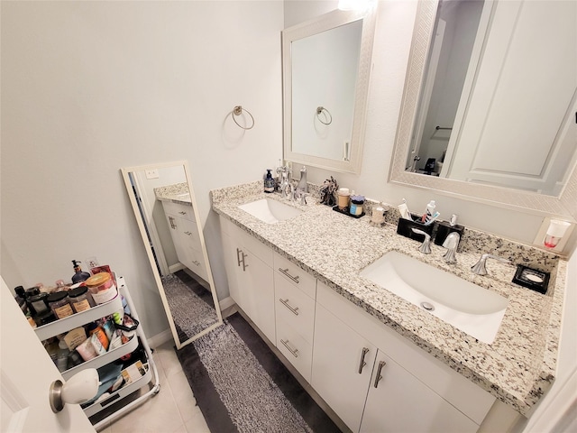 18841 Elegance Ave, Spring, TX 77379 - bathroom featuring double vanity and tile patterned floors