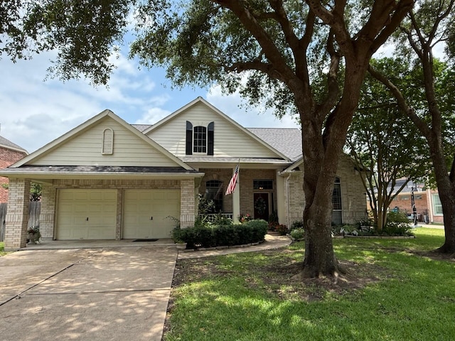 22602 Water Edge Ln, Katy, TX 77494 - view of front of house with brick siding, a garage, concrete driveway, and a front yard