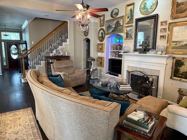 22602 Water Edge Ln, Katy, TX 77494 - living room featuring ceiling fan, ornamental molding, wood-type flooring, stairs, and arched walkways