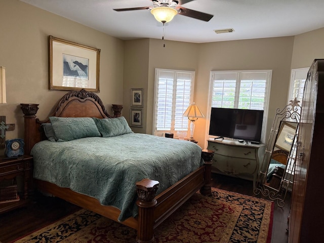 22602 Water Edge Ln, Katy, TX 77494 - bedroom with dark wood finished floors and ceiling fan