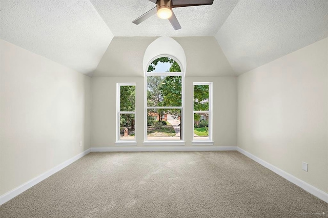 8002 Oxfordshire Dr, Spring, TX 77379 - bonus room featuring ceiling fan, carpet, baseboards, a textured ceiling, and vaulted ceiling