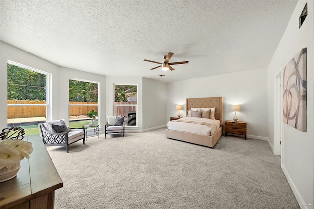 8002 Oxfordshire Dr, Spring, TX 77379 - bedroom featuring carpet floors, baseboards, a textured ceiling, and ceiling fan
