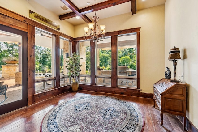 9502 Clubhouse Cir, Magnolia, TX 77354 - sunroom / solarium with plenty of natural light, coffered ceiling, beam ceiling, and a chandelier