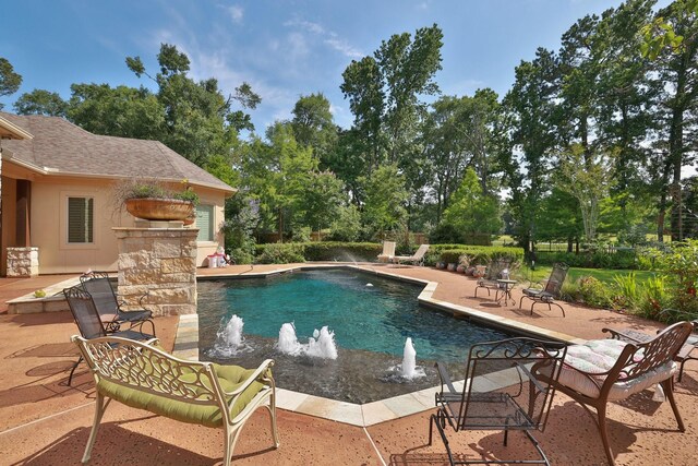 9502 Clubhouse Cir, Magnolia, TX 77354 - outdoor pool featuring a patio area and view of scattered trees