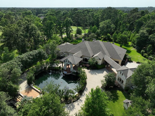 9502 Clubhouse Cir, Magnolia, TX 77354 - aerial view of property and surrounding area with a heavily wooded area