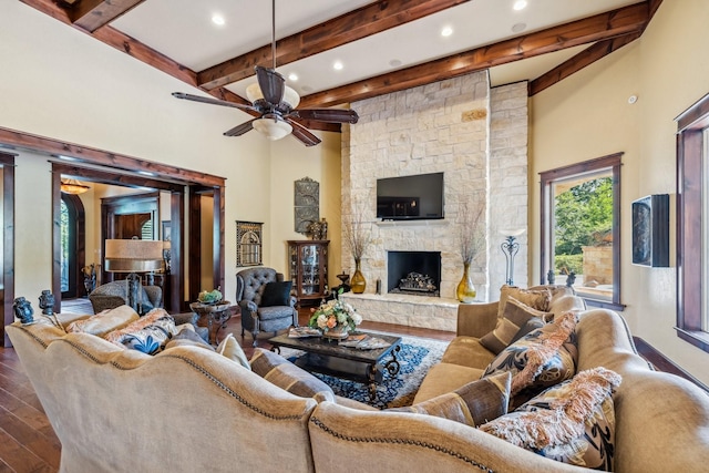 9502 Clubhouse Cir, Magnolia, TX 77354 - living area featuring beam ceiling, wood finished floors, a ceiling fan, recessed lighting, and a fireplace
