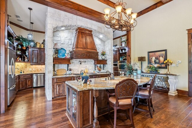 9502 Clubhouse Cir, Magnolia, TX 77354 - kitchen featuring stainless steel appliances, dark wood-style floors, premium range hood, decorative backsplash, and light stone counters