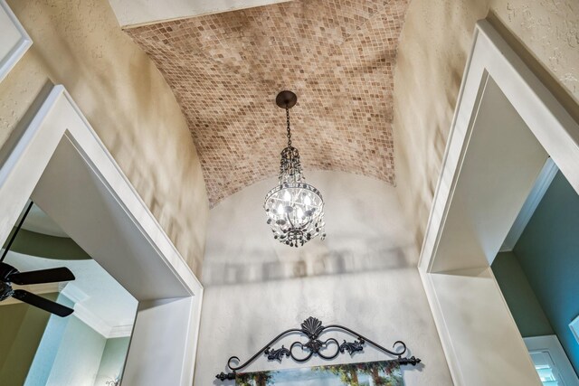 9502 Clubhouse Cir, Magnolia, TX 77354 - detailed view of a chandelier and a ceiling fan