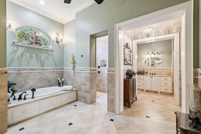 9502 Clubhouse Cir, Magnolia, TX 77354 - bathroom with ornamental molding, tile walls, vanity, a bath, and a wainscoted wall