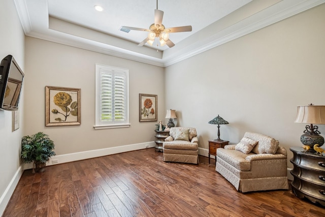9502 Clubhouse Cir, Magnolia, TX 77354 - living area with a raised ceiling, baseboards, wood finished floors, a ceiling fan, and crown molding
