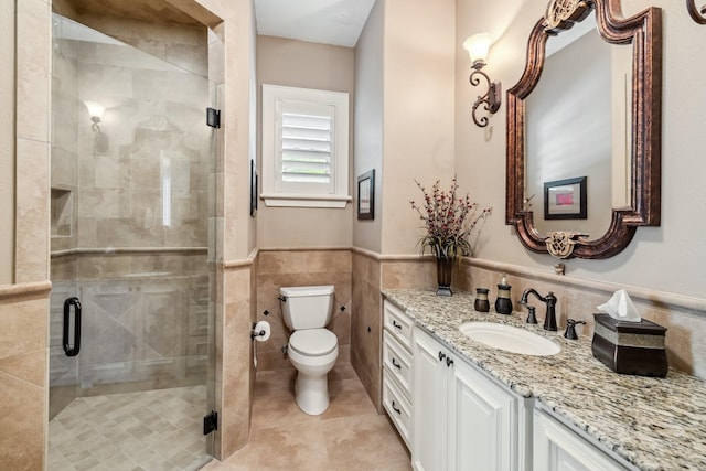 9502 Clubhouse Cir, Magnolia, TX 77354 - full bath with vanity, tile walls, toilet, tile patterned flooring, and a shower stall