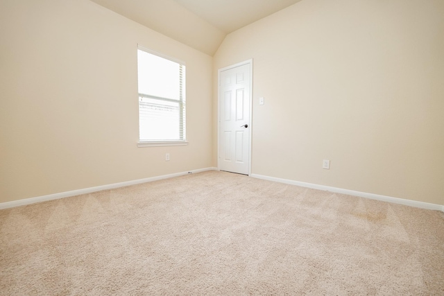 27326 Pendleton Trace Dr, Spring, TX 77386 - spare room with vaulted ceiling, baseboards, and light colored carpet