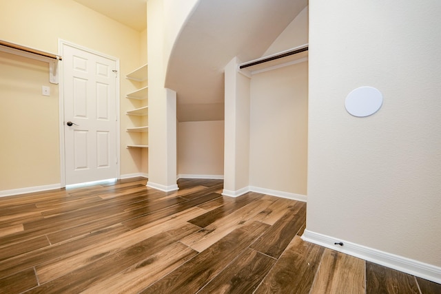 27326 Pendleton Trace Dr, Spring, TX 77386 - spacious closet with arched walkways, wood finished floors, and lofted ceiling
