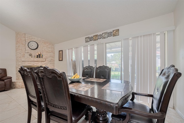 25514 Wingfield Ln, Spring, TX 77373 - dining area with lofted ceiling and a textured ceiling