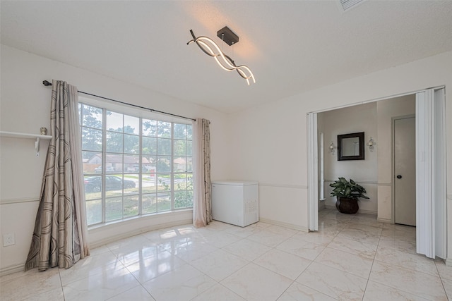 25514 Wingfield Ln, Spring, TX 77373 - unfurnished room featuring healthy amount of natural light and baseboards