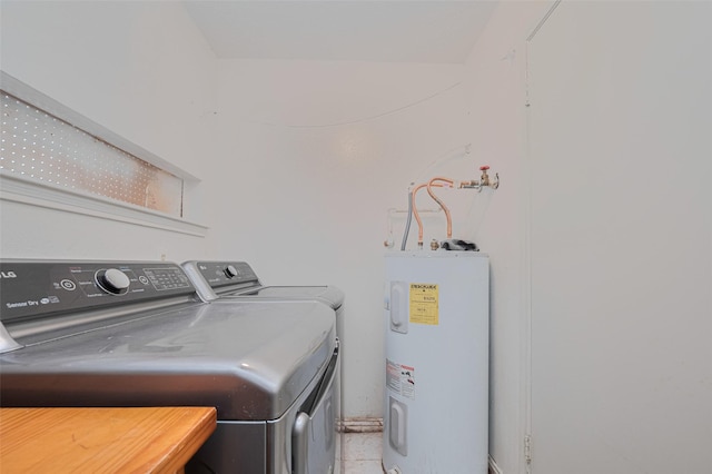 25514 Wingfield Ln, Spring, TX 77373 - laundry area featuring electric water heater and washing machine and clothes dryer