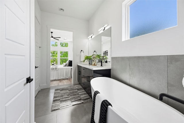 7212 England St, Houston, TX 77021 - bathroom featuring ensuite bathroom, a freestanding tub, a ceiling fan, and vanity
