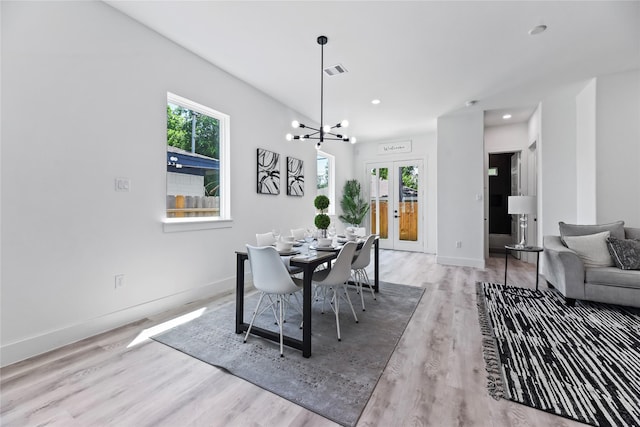 7212 England St, Houston, TX 77021 - dining area featuring wood finished floors, baseboards, a chandelier, and recessed lighting