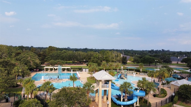 9311 Crescent Mill Dr, Missouri City, TX 77459 - drone / aerial view of a pool and a tree filled landscape