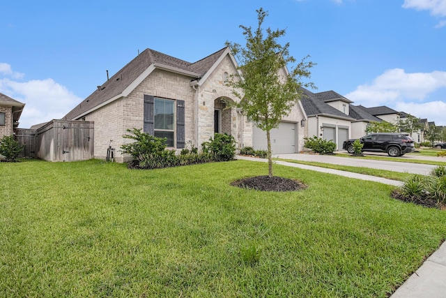 9311 Crescent Mill Dr, Missouri City, TX 77459 - french country style house featuring driveway, brick siding, an attached garage, and roof with shingles