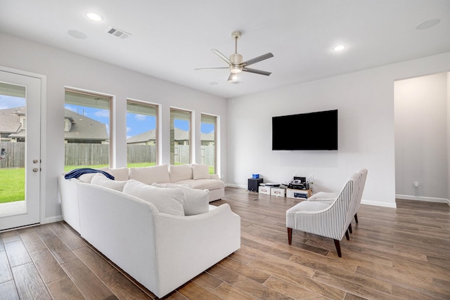 9311 Crescent Mill Dr, Missouri City, TX 77459 - living area featuring a ceiling fan, wood finished floors, recessed lighting, and baseboards