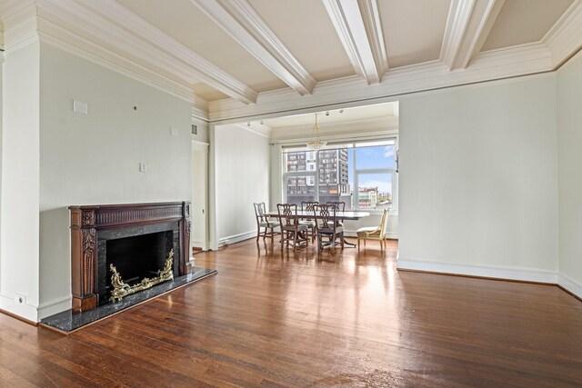 1700 Main St Unit 7B, Houston, TX 77002 - living room with crown molding, wood finished floors, beamed ceiling, a premium fireplace, and a chandelier